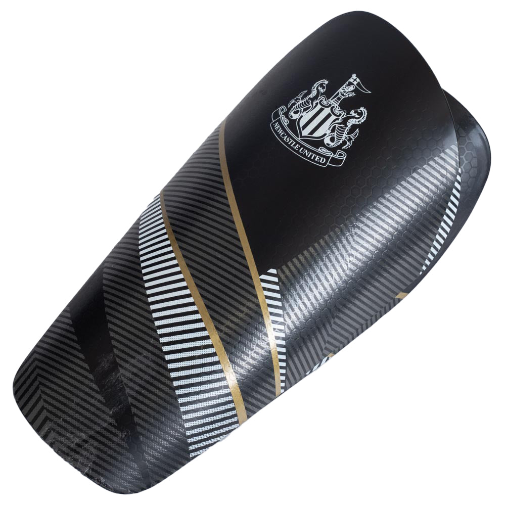 Black shin guard with white and gold stripes and Newcastle United logo